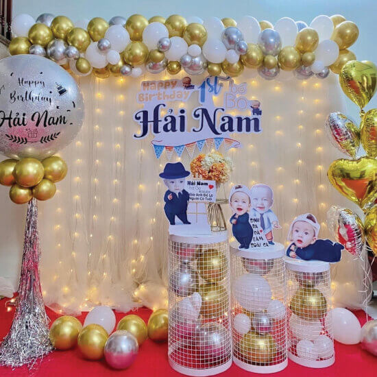 a balloon arch with balloons and lights